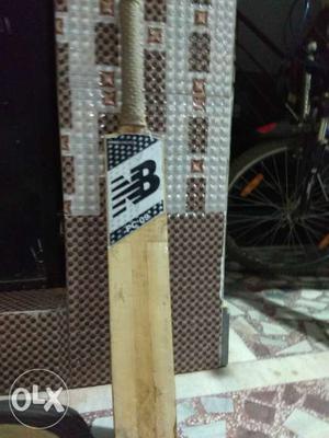 Brown And Black New Balance Cricket Bat