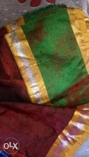 Green, Red, And Brown Textile