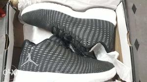 Nike Air Jordan pair of black-and- grey shoes.