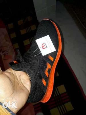 Orange And Black Running Shoe