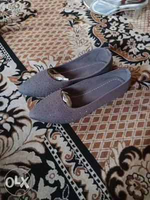 Pair Of Grey Suede Flats
