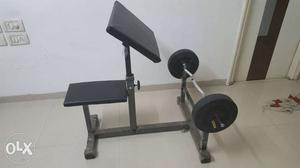 Preacher curl bench with curl rod and 10kg weight