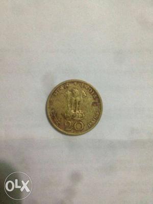 Round Gold-colored 20 India Paise Coin