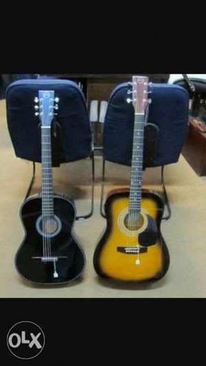 Two Black And Brown Dreadnought Acoustic Guitars