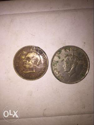 Two Round Silver-colored Coins