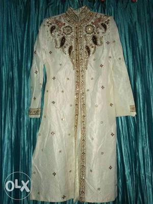 White And Gold-colored Floral Sherwani Suit
