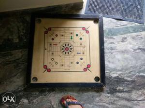 Wooden carrom board in new and a ludo game