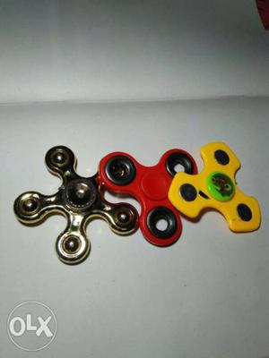 Yellow, Red, And Silver Fidget Spinners
