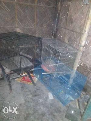 Two Gray And Black Pet Cages