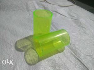 Two Green Plastic Tubes