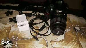 Black nikond  DSLR Camera With Telephoto Lens