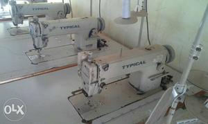 Three White Typical Sewing Machines