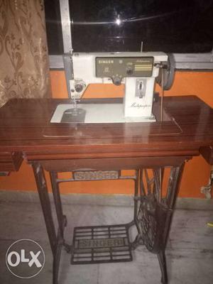 White And Brown Electric Sewing Machine