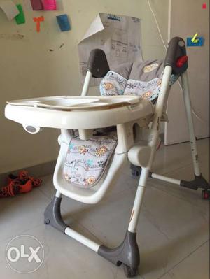 Baby's White And Gray High Chair