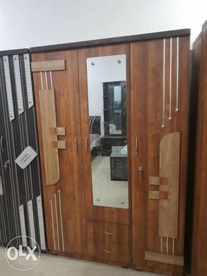 Brown Wooden Closet With Mirror