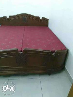 Brown wooden double bed, pure teak wood, curving