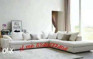 White Leather Sectional Couch With Text Overlay