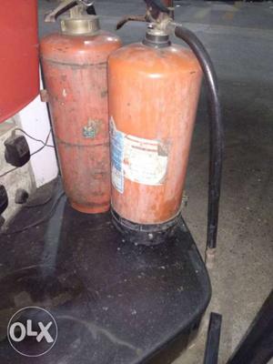 Two Red Fire Extinguishers
