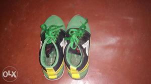 Green and black shoes number 6