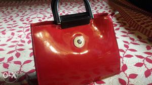 Its new red hand bag for ladies... purches it