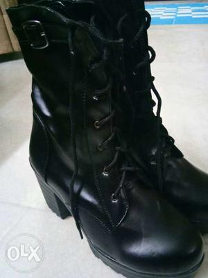 Pair Of Black Leather Boots