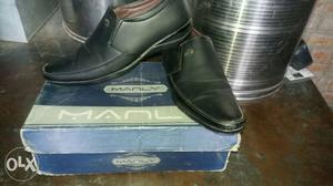 Pair Of Black Leather Dress Shoes