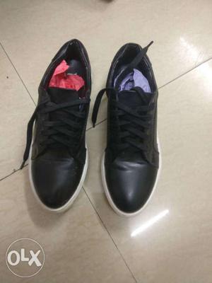Pair Of Black Leather Low-top Sneakers