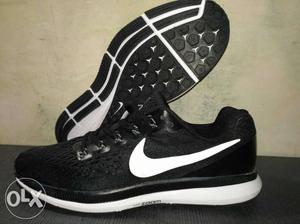 Pair Of Black-and-white Nike Zoom Sneakers