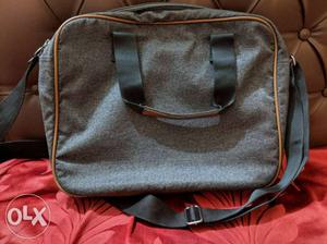 Puma messenger bag. It's a smart college bag, in a good