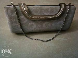 Silver glittering clutch at throw away price