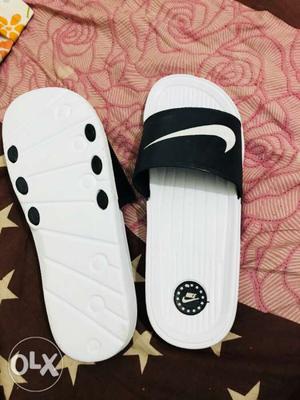 White-and-black Nike Slide Sandals
