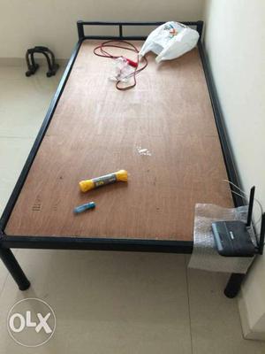 Single bed, in good condition, with supporting plywood