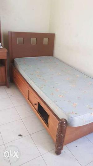 Single bed with mattress with sliding storage
