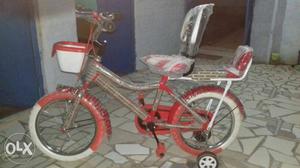 White And Red Bicycle With Training Wheels