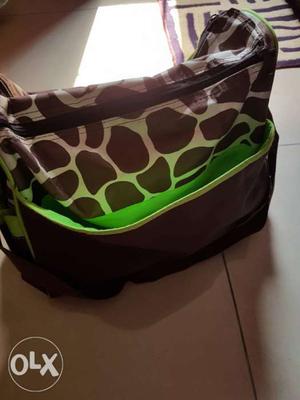 White, Green, And Brown Diaper Bag