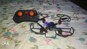 Black And Orange Drone With Controller