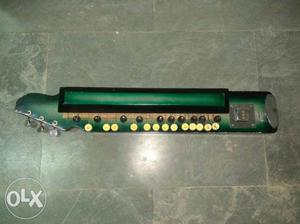 Green And Brown Musical Instrument