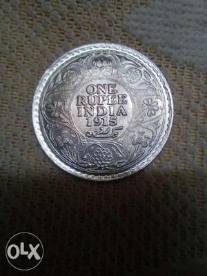 Old silver Indian one rupees coin in a good