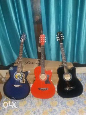 One, Blue, Orange, And Black Cut-away Acoustic Guitars
