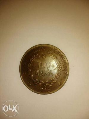 Round Gold-colored Two Anna Rupee Coin