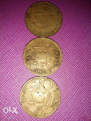 Three Round Silver-colored 20 Indian Paise Coins