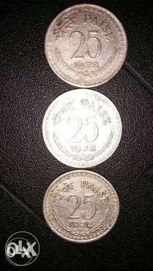 Three Round Silver-colored 25 India Paise Coins