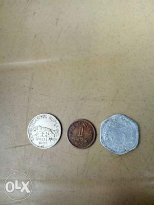 Three Round Silver-colored And Brown Coins