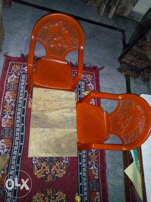 Two plactic chair's for kids and one wooden small table