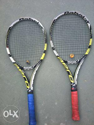 A pair of Babolat Aero prolite tennis rackets for