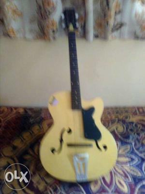 Black and yellow top condition guitar