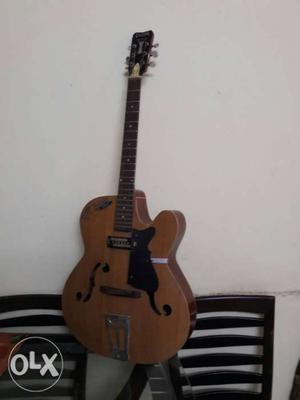 Givson.. Brown And Black Jazz Guitar with pick up fitted