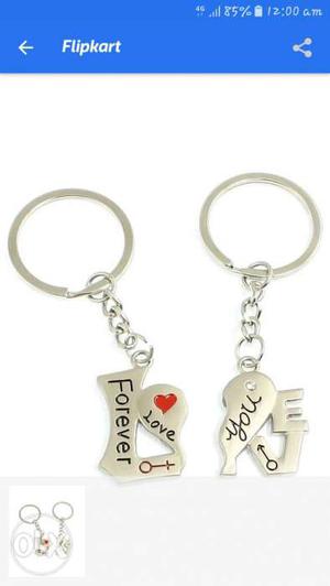 Pair Of Silver-colored Love Keychains
