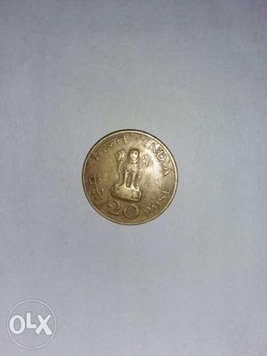 Round Gold-colored Indian Paise Coin