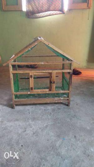 A nice wooden cage for all birds